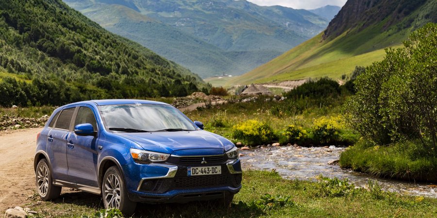 Mitsubishi ASX rental car on a mountain road in Georgia