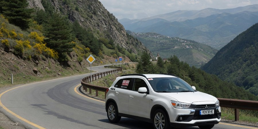 Mitsubishi ASX rental car on a mountain road in Georgia