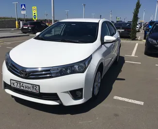 Frontvisning av en leiebil Toyota Corolla på Simferopol lufthavn, Krim ✓ Bil #1402. ✓ Automatisk TM ✓ 0 anmeldelser.