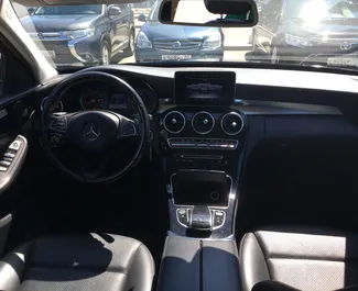 무제한의 주행 제한이 있는 심페로폴 공항에서 대여 가능한 Mercedes-Benz C180 2016.