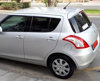 Front view of a rental Suzuki Swift in Limassol, Cyprus ✓ Car #272. ✓ Automatic TM ✓ 2 reviews.