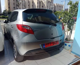 Mazda Demio 2015 car hire in Cyprus, featuring ✓ Petrol fuel and 100 horsepower ➤ Starting from 18 EUR per day.