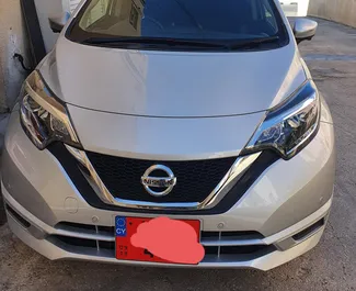 Priekinė automobilio, kurį nuomojate Nissan Note Pafose, Kipras vaizdas ✓ Automobilis #2302. ✓ Pavarų dėžė Automatinis TM ✓ Atsiliepimai 5.