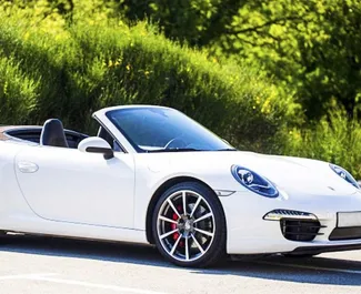 Najem avtomobila Porsche Carrera 911 S Cabrio 2014 v v Črni gori, z značilnostmi ✓ gorivo Bencin in 390 konjskih moči ➤ Od 1180 EUR na dan.