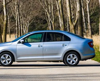 Interior of Skoda Rapid for hire in Montenegro. A Great 5-seater car with a Manual transmission.