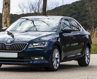 Front view of a rental Skoda Superb in Becici, Montenegro ✓ Car #2482. ✓ Automatic TM ✓ 1 reviews.