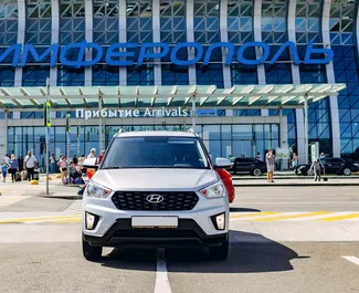 Vista frontal de um aluguel Hyundai Creta no aeroporto de Simferopol, Crimeia ✓ Carro #2643. ✓ Transmissão Automático TM ✓ 0 avaliações.