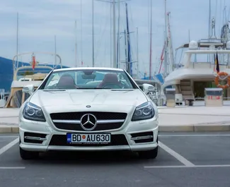 Sprednji pogled najetega avtomobila Mercedes-Benz SLK Cabrio v v kraju Rafailovici, Črna gora ✓ Avtomobil #3761. ✓ Menjalnik Samodejno TM ✓ Mnenja 0.