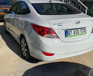 Прокат машини Hyundai Accent Blue #3810 (Автомат) в аеропорту Анталії, з двигуном 1,6л. Бензин ➤ Безпосередньо від Диван в Туреччині.