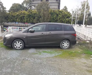 Vue de face d'une location Mazda Premacy à Limassol, Chypre ✓ Voiture #3890. ✓ Automatique TM ✓ 0 avis.