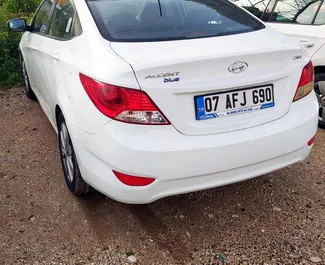 Front view of a rental Hyundai Accent Blue at Antalya Airport, Turkey ✓ Car #3901. ✓ Automatic TM ✓ 1 reviews.