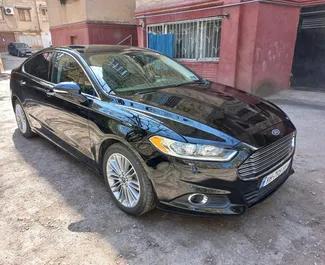 Front view of a rental Ford Fusion Sedan at Tbilisi Airport, Georgia ✓ Car #4184. ✓ Automatic TM ✓ 0 reviews.