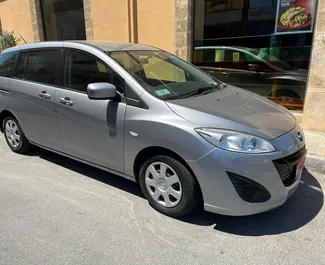 Frontvisning af en udlejnings Mazda Premacy i Larnaca, Cypern ✓ Bil #4379. ✓ Automatisk TM ✓ 0 anmeldelser.