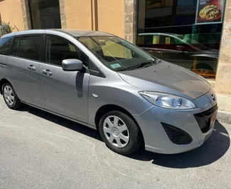 Vuokra-auton etunäkymä Mazda Premacy Larnakassa, Kypros ✓ Auto #4379. ✓ Vaihteisto Automaattinen TM ✓ Arvostelut 0.