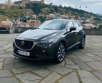 Vooraanzicht van een huurauto Mazda CX-3 in Tbilisi, Georgië ✓ Auto #4879. ✓ Transmissie Automatisch TM ✓ 0 beoordelingen.