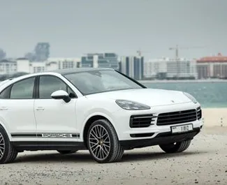 Frontvisning av en leiebil Porsche Cayenne Coupe i Dubai, De Forente Arabiske Emirater ✓ Bil #4936. ✓ Automatisk TM ✓ 0 anmeldelser.