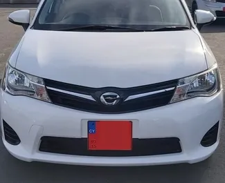 Framvy av en hyrbil Toyota Corolla Fielder på Paphos Airport, Cypern ✓ Bil #5026. ✓ Växellåda Automatisk TM ✓ 0 recensioner.