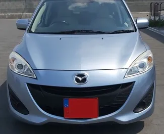 Přední pohled na pronájem Mazda Premacy na letišti Pafos, Kypr ✓ Auto č. 5029. ✓ Převodovka Automatické TM ✓ Recenze 0.