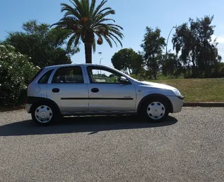 Opel Corsa 2004 automašīnas noma Spānijā, iezīmes ✓ Benzīns degviela un  zirgspēki ➤ Sākot no 35 EUR dienā.