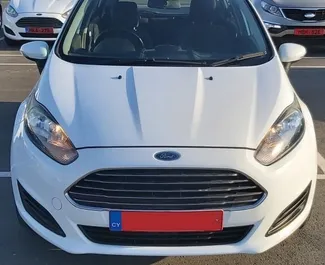 Front view of a rental Ford Fiesta at Paphos Airport, Cyprus ✓ Car #5020. ✓ Manual TM ✓ 0 reviews.
