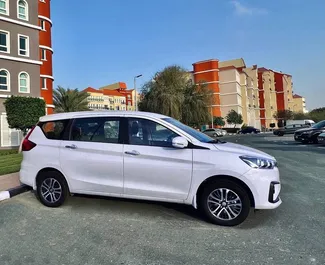 Suzuki Ertiga 2023 car hire in the UAE, featuring ✓ Petrol fuel and 120 horsepower ➤ Starting from 128 AED per day.