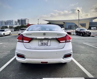 Suzuki Ciaz 2023 car hire in the UAE, featuring ✓ Petrol fuel and 120 horsepower ➤ Starting from 126 AED per day.