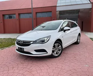 Front view of a rental Opel Astra Sports Tourer in Becici, Montenegro ✓ Car #5951. ✓ Manual TM ✓ 1 reviews.