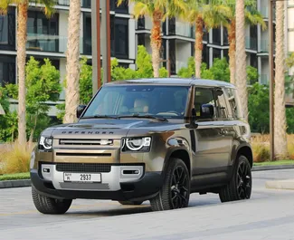 Land Rover Defender 2022 car hire in the UAE, featuring ✓ Petrol fuel and 400 horsepower ➤ Starting from 1300 AED per day.