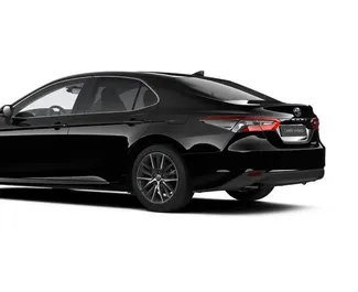 Toyota Camry 2023 car hire in the UAE, featuring ✓ Petrol fuel and 220 horsepower ➤ Starting from 235 AED per day.
