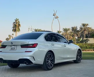 BMW 330i 2021 car hire in the UAE, featuring ✓ Petrol fuel and 300 horsepower ➤ Starting from 400 AED per day.