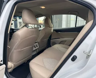 Toyota Camry 2023 available for rent in Dubai, with 250 km/day mileage limit.