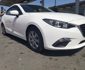 Mazda Axela 2015 araç kiralama Kıbrıs'ta, ✓ Benzin yakıt ve 60 beygir gücü özellikleriyle ➤ Günde başlayan fiyatlarla 40 EUR.