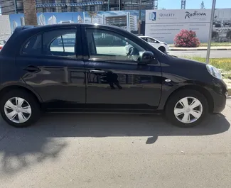 Vista frontal de um aluguel Nissan March em Larnaca, Chipre ✓ Carro #6510. ✓ Transmissão Automático TM ✓ 0 avaliações.