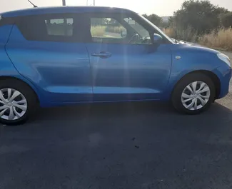 Front view of a rental Suzuki Swift in Larnaca, Cyprus ✓ Car #6512. ✓ Automatic TM ✓ 0 reviews.