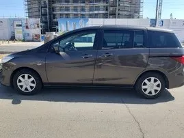 Vista frontal de un Mazda Premacy de alquiler en Larnaca, Chipre ✓ Coche n.º 6503. ✓ Automático TM ✓ 0 opiniones.