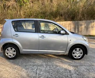 Daihatsu Sirion 2010 car hire in Montenegro, featuring ✓ Petrol fuel and 103 horsepower ➤ Starting from 25 EUR per day.