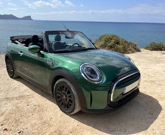 Front view of a rental Mini Cooper Cabrio at Ibiza Airport, Spain ✓ Car #6603. ✓ Automatic TM ✓ 1 reviews.