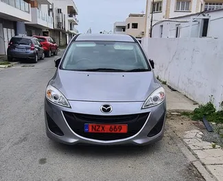 Frontvisning av en leiebil Mazda Premacy i Larnaca, Kypros ✓ Bil #3978. ✓ Automatisk TM ✓ 0 anmeldelser.