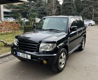 Front view of a rental Mitsubishi Pajero Io in Tbilisi, Georgia ✓ Car #6717. ✓ Automatic TM ✓ 1 reviews.