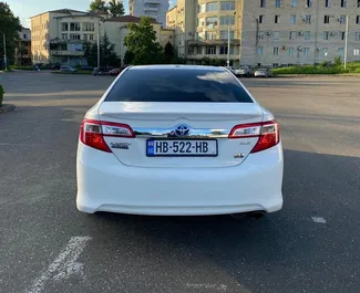 Toyota Camry 2014 available for rent in Kutaisi, with unlimited mileage limit.