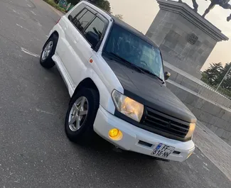 Front view of a rental Mitsubishi Pajero Io in Kutaisi, Georgia ✓ Car #6776. ✓ Automatic TM ✓ 0 reviews.