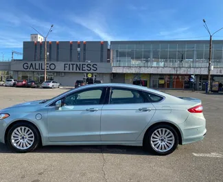 Hybrid 2.0L engine of Ford Fusion Sedan 2017 for rental in Kutaisi.