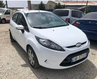 Front view of a rental Ford Fiesta at Tirana airport, Albania ✓ Car #7001. ✓ Manual TM ✓ 2 reviews.