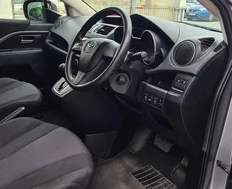 Mazda Premacy 2015 autóbérlés Cipruson, jellemzők ✓ Benzin üzemanyag és 120 lóerő ➤ Napi 98 EUR-tól kezdődően.