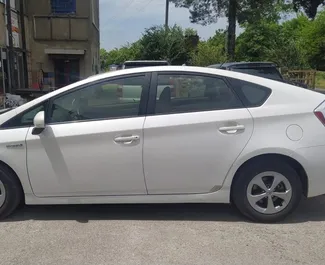 Petrol 1.8L engine of Toyota Prius 2012 for rental at Kutaisi Airport.