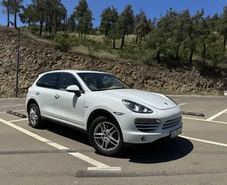 Front view of a rental Porsche Cayenne in Tbilisi, Georgia ✓ Car #6543. ✓ Automatic TM ✓ 0 reviews.