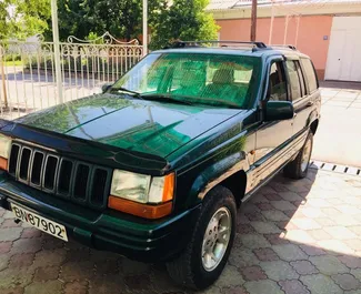 Front view of a rental Jeep Grand Cherokee in Osh, Kyrgyzstan ✓ Car #7074. ✓ Automatic TM ✓ 0 reviews.