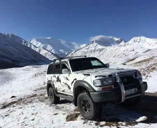 Front view of a rental Toyota Land Cruiser 80 in Osh, Kyrgyzstan ✓ Car #7077. ✓ Automatic TM ✓ 0 reviews.