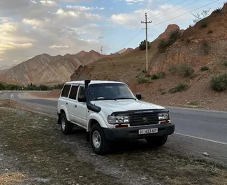 Front view of a rental Toyota Land Cruiser 80 in Osh, Kyrgyzstan ✓ Car #7079. ✓ Automatic TM ✓ 0 reviews.