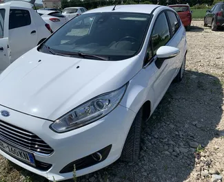 Front view of a rental Ford Fiesta at Tirana airport, Albania ✓ Car #7123. ✓ Manual TM ✓ 1 reviews.